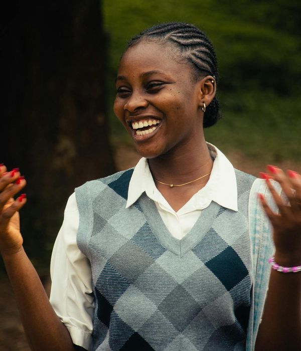 Woman feeling energetic and full of life in a bright open space.